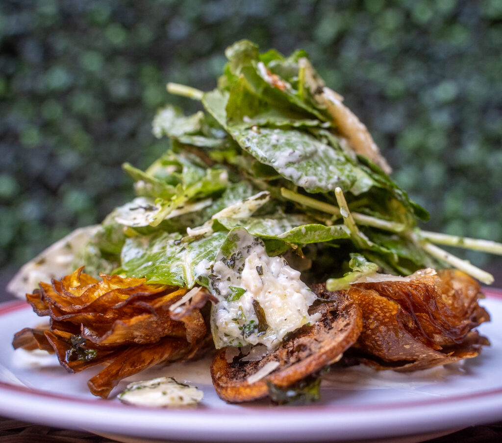 dressed salad with crispy fried artichoke pieces